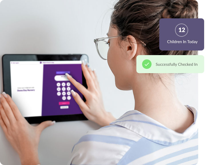 Staff member signing into nursery using the Nursery In a Box digital check in app